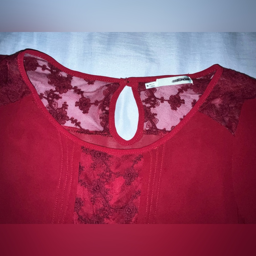 Maurice red top with lace and sheer in Medium.